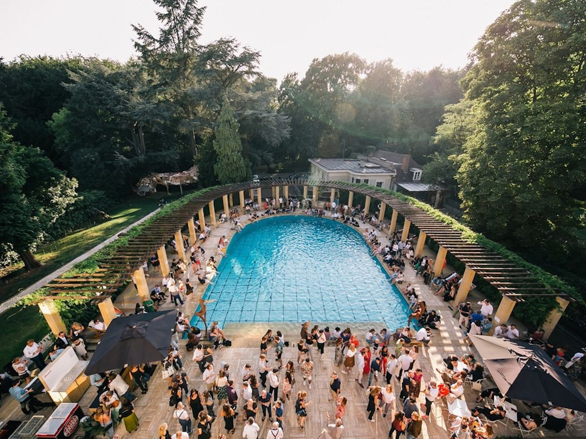 Evening reception around the pool of the Villa Empain